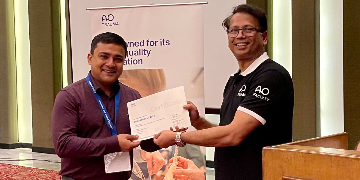 Receiving certificate for attending AO trauma course from Dr Ranjan Kamylia (Kolkata)
